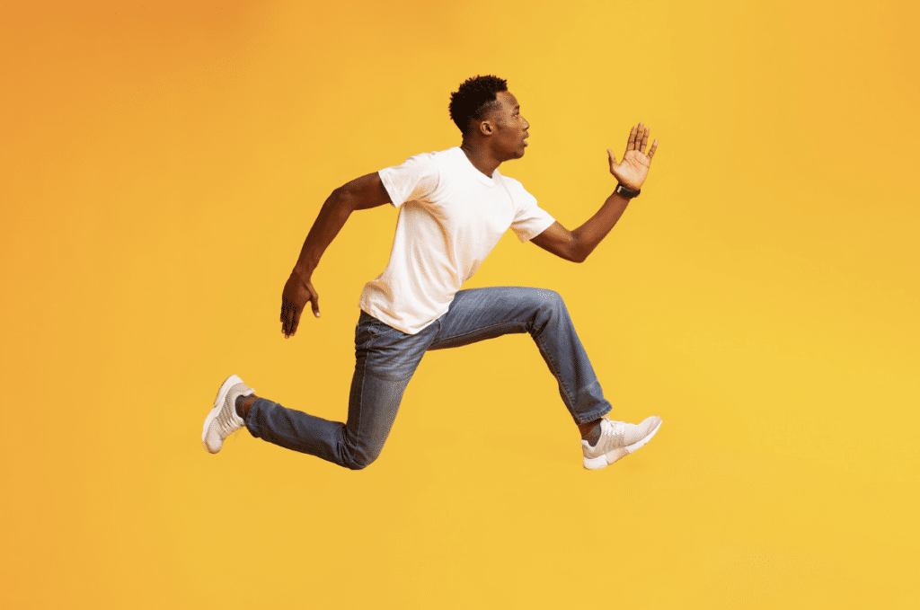 african male, mid air run to represent cognitive bias of scarcity:psychological triggers in marketing
